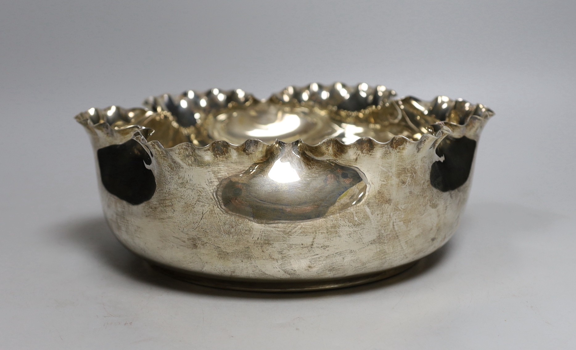 A late Victorian silver circular fruit bowl, with pinched wavy border, by Frederick Elkington, Birmingham, 1888, diameter 28cm, 22.9oz.